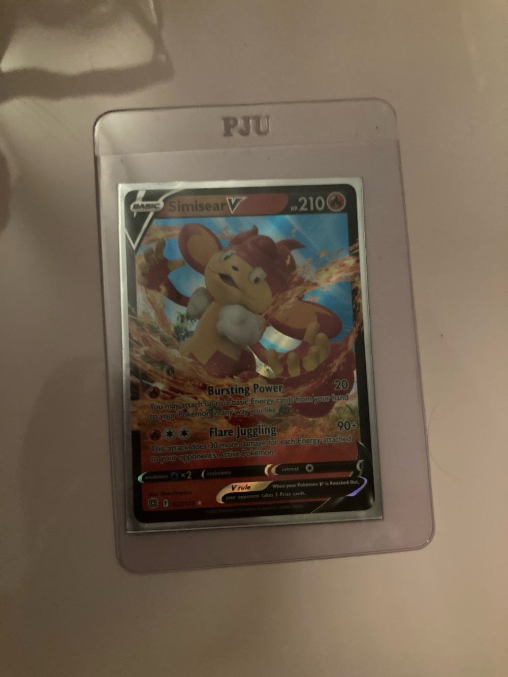 Pokemon Simisear V Card in Red and Orange Hues